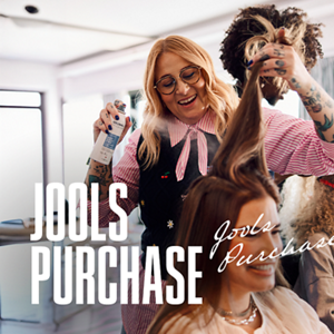 A stylist Jools Purchase talks to a customer