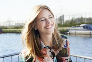 Pretty woman on a boat with dyed honey blonde hair