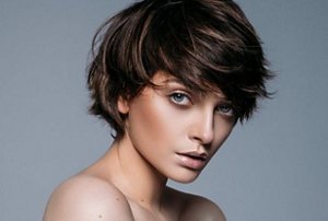 Brunette woman with a bixie cut