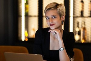 Stylish woman with a smooth, sleek bixie cut