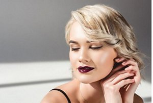 Young woman with a 1990s style bixie haircut