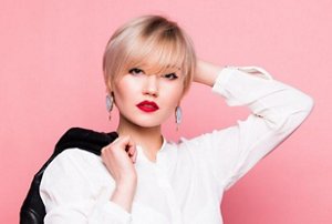 Stylish woman with a sleek, tamed bixie cut