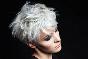 Blonde woman with a tousled bixie cut hairstyle