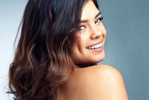 Woman with long dark hair with espresso-coloured balayage