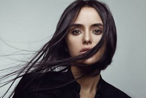 Woman with long, conditioned dark brunette hair