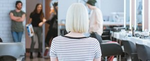Young woman with a platinum blunt-cut blonde bob