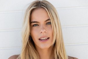 Blonde woman with highlighted hair and dark roots