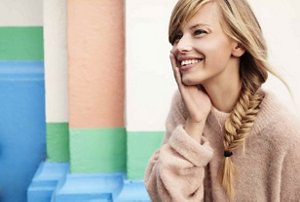 Smiling woman with a fishtail braid