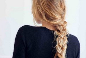 Blonde woman with a messy braid