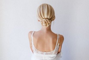 Elegant bride with a low bun wedding hairstyle