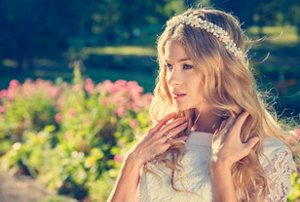 Bride with long mermaid waves wearing a flower crown