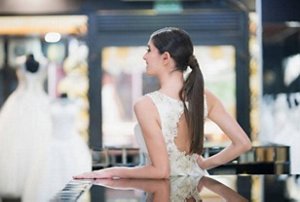 Modern bride with a long, sleek ponytail hairstyle