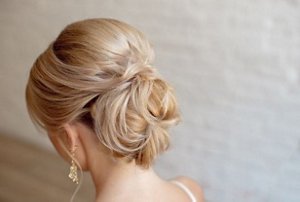 Blonde bride with an elegant chignon hairstyle