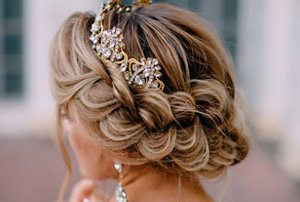 Blonde bridesmaid with a braided crown updo hairstyle