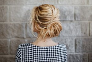 Blonde woman with French twist hairstyle