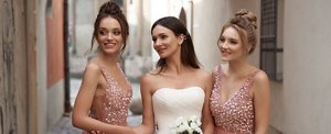 A bride with her two bridesmaids on her wedding day