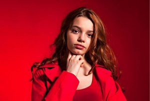 Woman wearing red with cherry cola deep red hair colour
