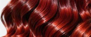 Close-up of richly-coloured cherry cola hair colour