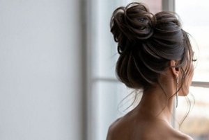Elegant woman with a neat bun hairstyle