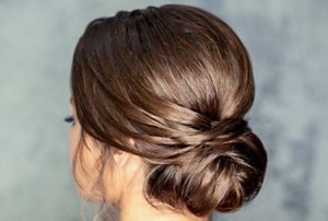 Brunette woman with an elegant chignon hairstyle