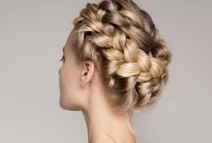 Blonde woman with a Greek halo braid hairstyle