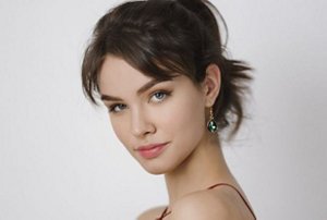 Woman with a ponytail with short curtain bangs