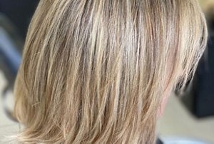 Dirty blonde hair with a gentle brunette root smudge