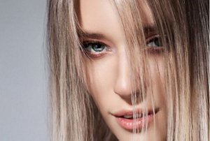 Woman with cool ash dirty blonde hair