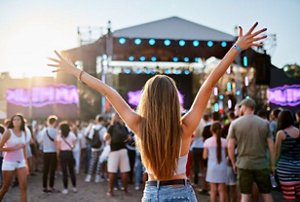 Woman with long hair having fun at a music festival
