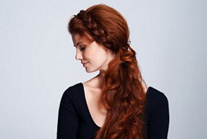 Redheaded woman with a halo braid hairstyle