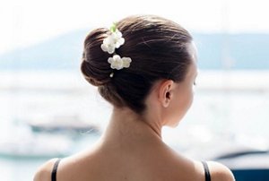 Brunette woman with a ballerina bun hairstyle