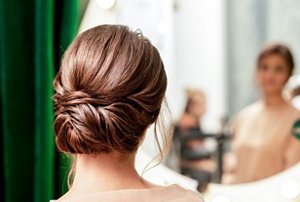 Elegant brunette woman with a chignon hairstyle