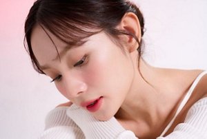 Woman with light, wispy bangs