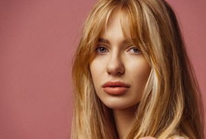 Woman with long bangs with layers cut into them