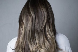 Woman with long dark greige hair