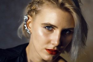 Woman with a short hairstyle with side braids