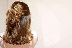 Woman with a half-up, half down hairstyle