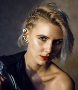 Woman with short hair with side braids