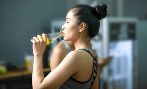 Young woman staying hydrated after a workout