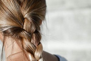 Brunette with long hair in a plait