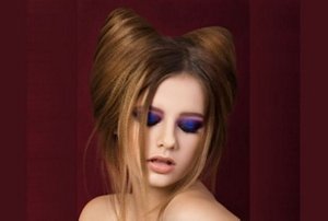 Woman dressed for Halloween with a cat ears hairstyle