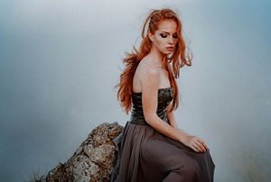 Redheaded woman with long Viking braids hairstyle