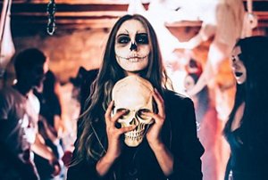 Woman dressed for Halloween as a zombie