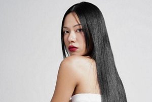 Elegant woman with long black hair with a subtle hime cut