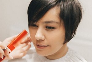 Woman with a pixie cut with light feathered layers