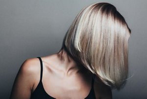 Blonde woman with an angled, sweeping long bob