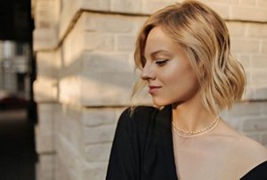 Blonde woman with styled mid-length lob