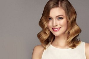 Smiling woman with a long bob with ombre