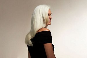 Older woman with thick, long, natural silver hair