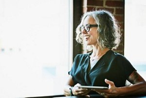 Woman in her 40s with a textured and styled lob cut